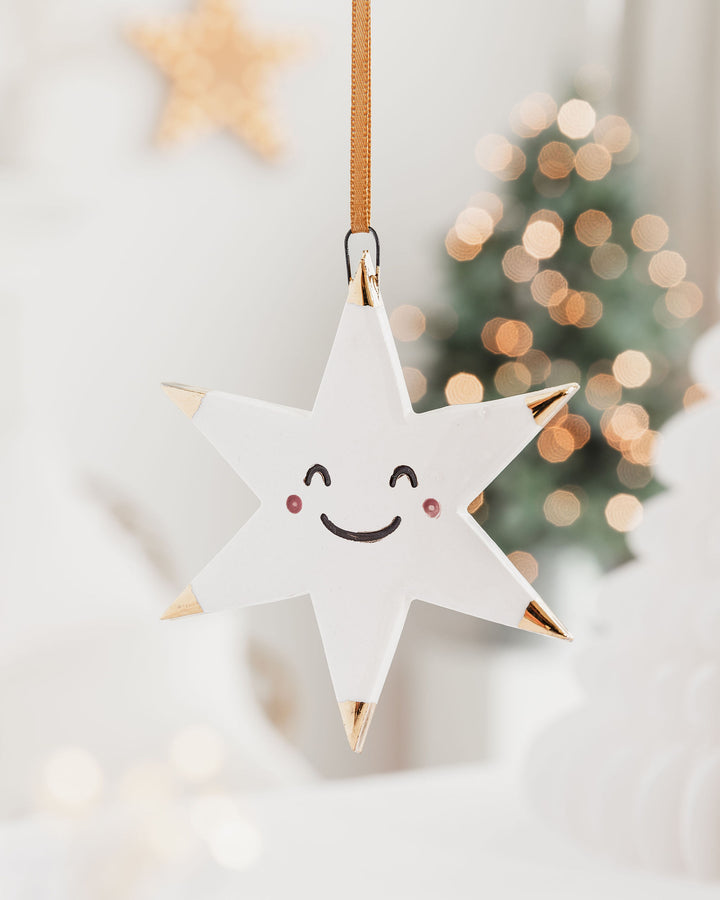 White Star Christmas Ornament with Smiley Face and Gold Tips