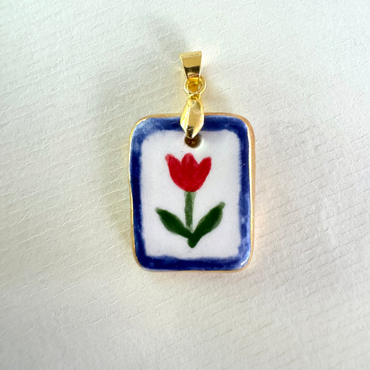 Red flower with blue border Pendant