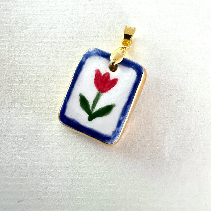 Red flower with blue border Pendant