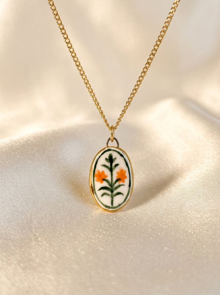 Orange Flowers with green border Pendant
